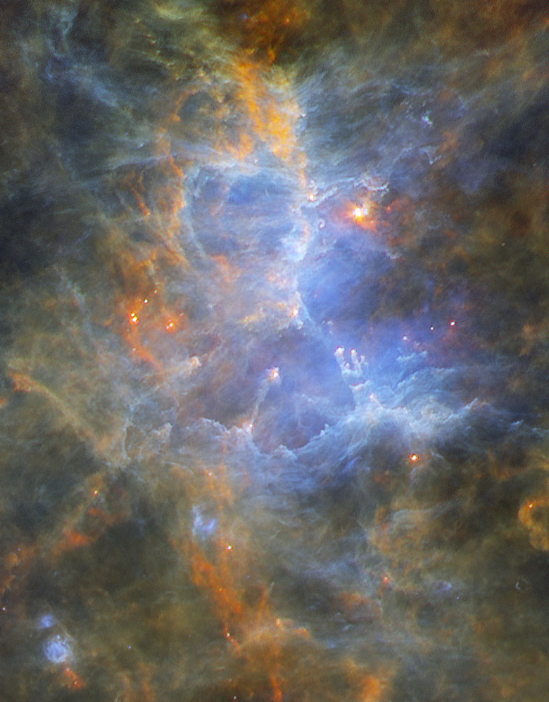 Das nebelige Bild zeigt den Adlernebel M16 in Infrarot. Die Bilddaten stammen vom Weltraumteleskop Herschel. M16 enthält auch die Säulen der Schöpfung, die das Weltraumteleskop Hubble berühmt machten.